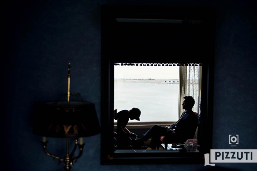 Boston Harbor Hotel Wedding Groomsmen Gets His Shoes Shined