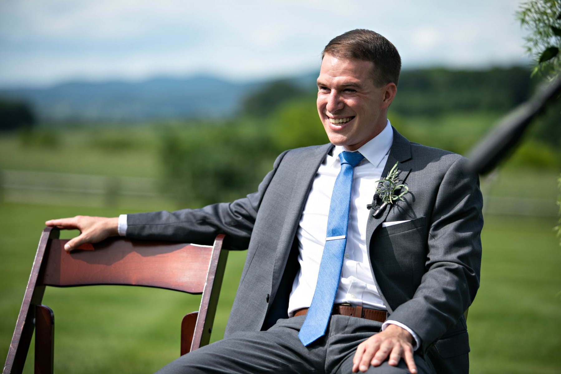 ceremony-groom-smiling-vermont-farm-wedding