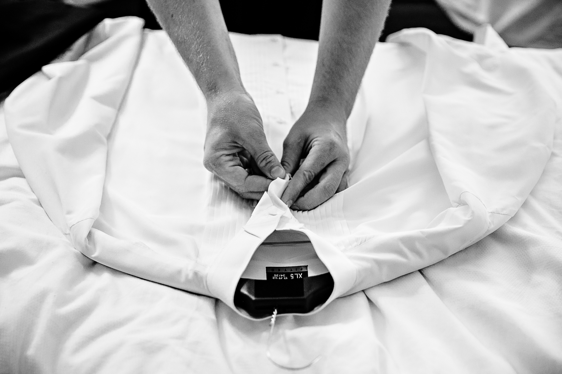 groom-getting-ready-dress-shirt