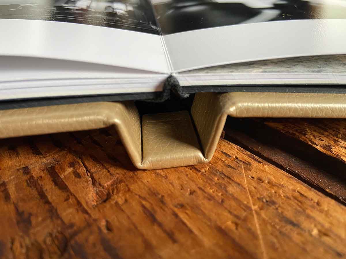 gold wedding album opened showing spine